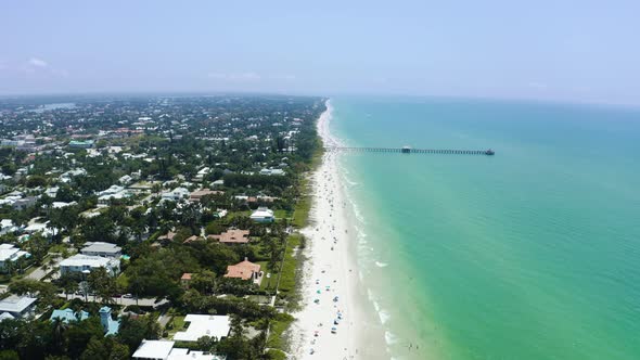 Aerial Drone Shot of Ocean Waves Crashing on Beach alt