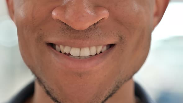 Close Up of Mouth of Casual African Man Smiling  alt