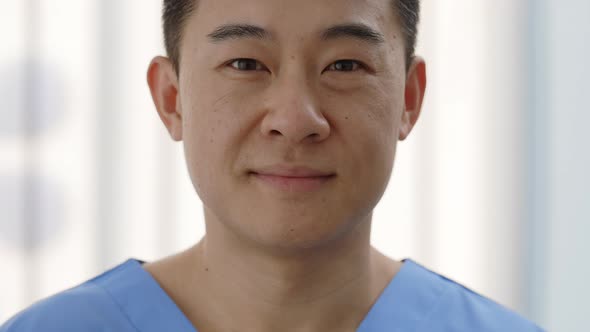 Close Up View of Positive Man Doctor in Uniform Looking to Camera alt