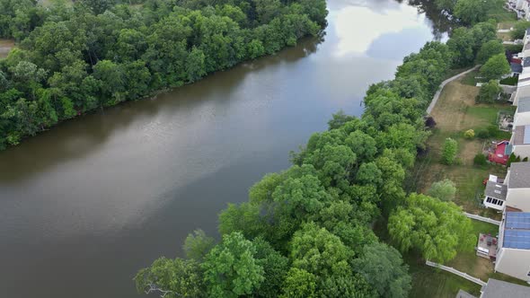Aerial View of Town Along the River with Residential Areas of Private Houses alt