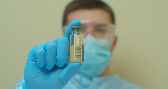 Doctor of Laboratory Showing a Coronavirus Cure.