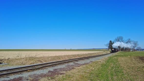 Approaching Steam Passenger Train Blowing Smoke and Steam alt
