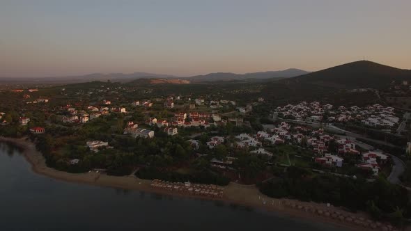 Cottages on Sea Shore of Trikorfo Beach in Greece, Aerial alt