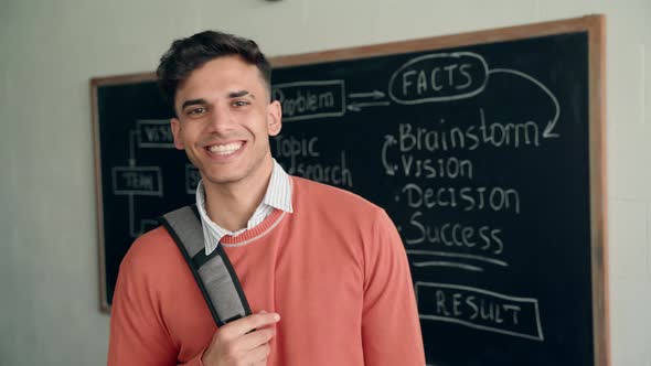 Portrait of Young Indian Latin Student Standing in Classroom Looking at Camera alt