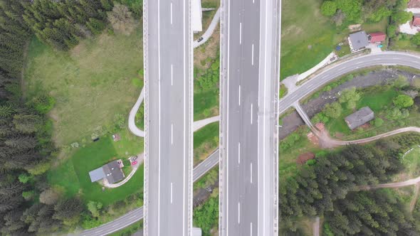 Aerial Top View of Highway Viaduct with Multilane Traffic in Mountains. Autobahn in Austria alt
