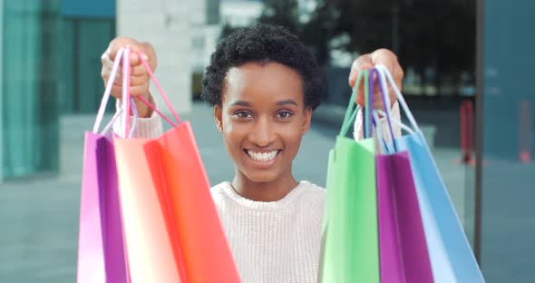 Close-up Portrait African American Woman Consumer Shopper Buyer Shopaholic Stands Posing alt