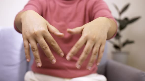 Women doing hands stretching after intense home office day protect office syndrome. Health care conc alt