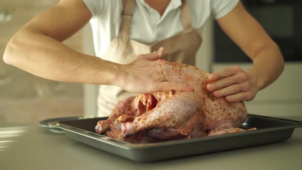 Woman Filling Butter Under Turkeys Skin