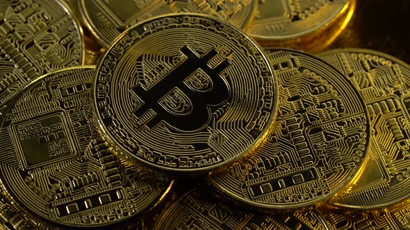 Beautiful Bitcoins Are Spinning Top View. Close Up alt