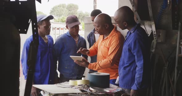 African men speaking of work to do alt