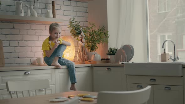 Little Girl Talking Using Her Kids Smart Watch alt