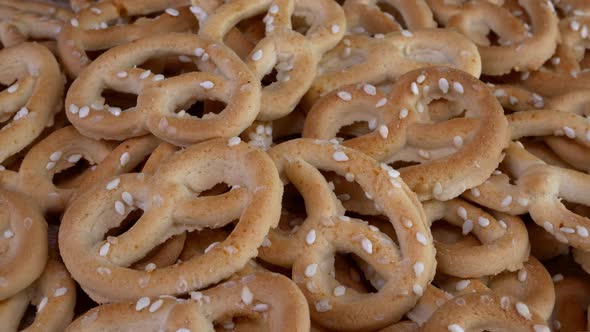 Pile of Pretzels Sprinkled with Sesame Rotate on a Turntable alt