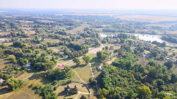 Aerial View of Ukrainian Small Village Against the Backdrop Green Fields and Sky alt