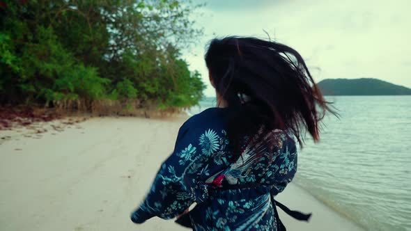 Cute Asian Girl in Kimono Running on a Beach at Sunset in Slow Motion Thailand