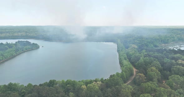 Aerial View a Smoke Coming From a Trees on Fire in the Forest Near Big Lake alt
