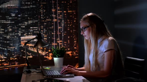 Pretty Psychologist Searching Books in Internet in Her Office alt