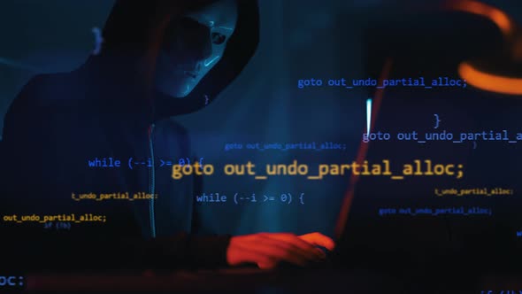 Hacker is Working on Laptop at Night alt