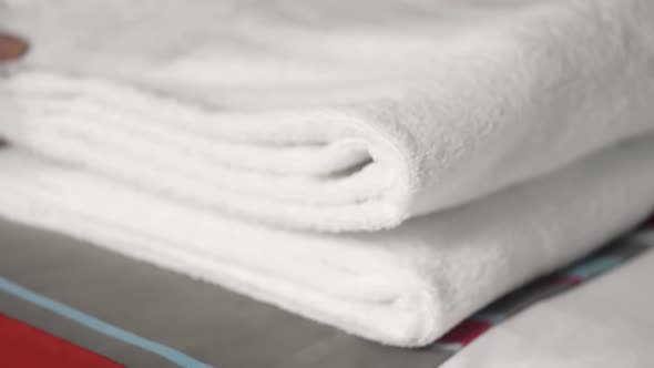 Woman's Hands on Mattress Surface Changing White Cotton Cover on Pillow alt