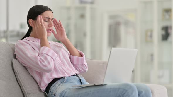 Stressed Young Latin Woman with Laptop Having Headache at Home  alt