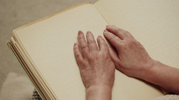 Blind Woman Reading Braille Book Top View Poorly Seeing Female Person Learning to Read Home alt