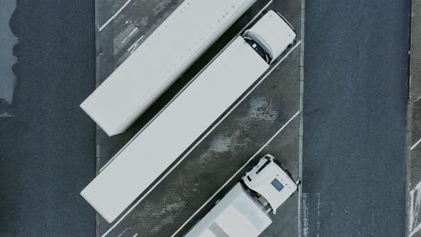 Video Filming From a Bird's Eye View of the Trucks Parked in the Parking Lot alt