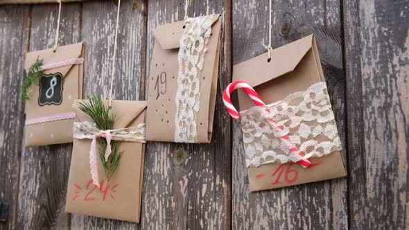 Christmas Advent Calendar on Wooden Background alt