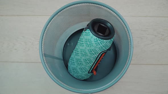 A Faulty Old Portable Music Player Lies at the Bottom of a Trash Can alt