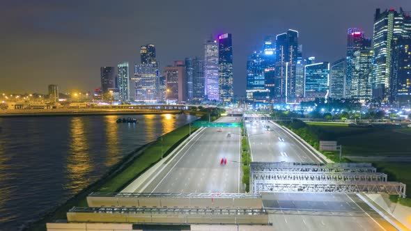 Aerial view traffic with background Singapore landmark. alt