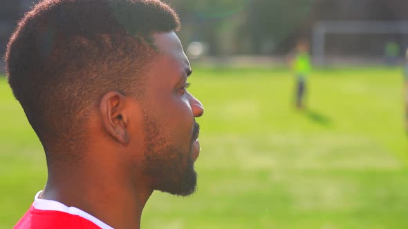 Brazilian Man Goalkeeper Catches the Ball in the Stadium During a Football Training alt
