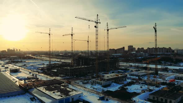 Urban Construction Site with Building Cranes alt