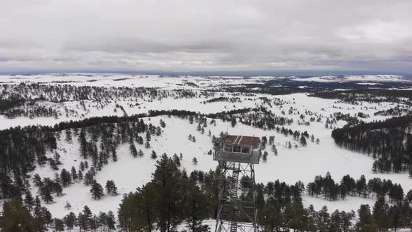 Aerial Fire Tower in Snow on Mountain alt