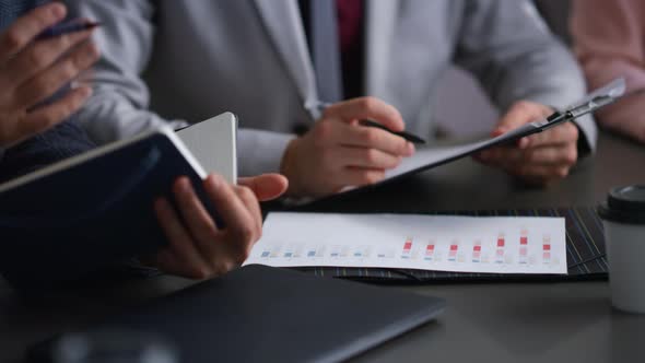 Corporate Colleagues Fill Forms in Bank alt