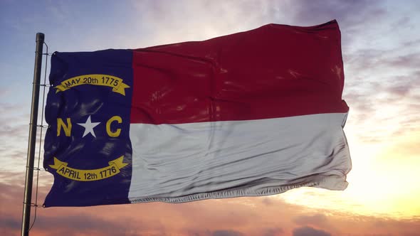 Flag of North Carolina Waving in the Wind Against Deep Beautiful Sky at Sunset alt