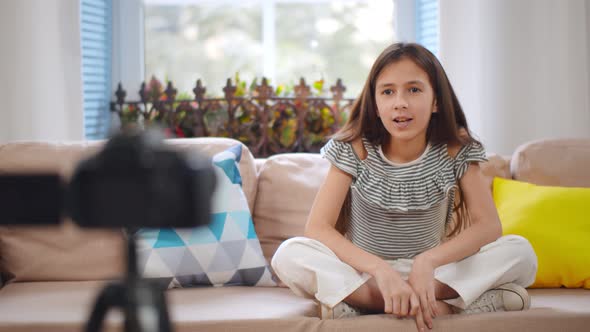 Happy Caucasian Girl Kid Recording Video on Camera for Internet Blog alt