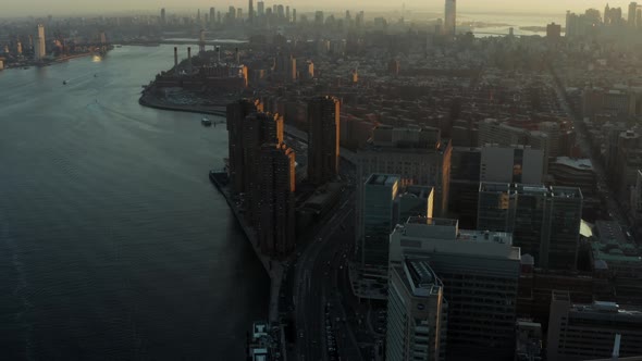Aerial Panoramic Shot of Cityscape Against Setting Sun alt