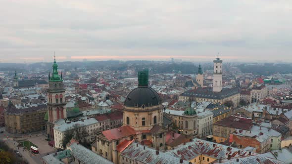 Flight Above the Roofs on Sunrise. Old European City. Ukraine Lviv City alt