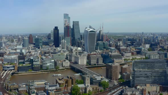 Drone shot of City of London Business district skyscrapers from south of the river thames alt