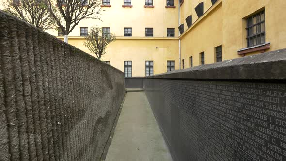 Names of dead prisoners on a wall  alt