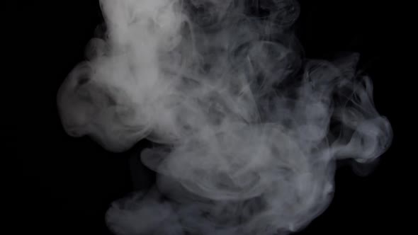 White Steam Spins And Rises From The Pan alt