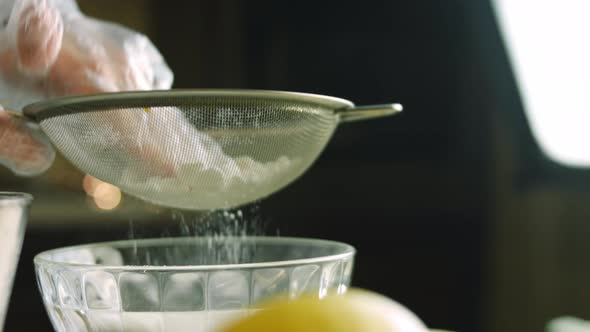 I Give Powdered Sugar Through a Stainless Steel Sieve alt
