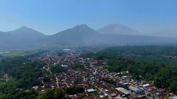 Scenic aerial panorama of Grabag village and three volcanoes, Java, Indonesia alt