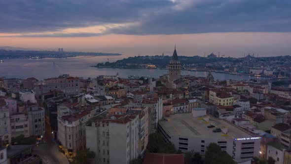 Galata Tower in Center of Istanbul Night To Day with Bosphorus and Istanbul Skyline, Aerial alt