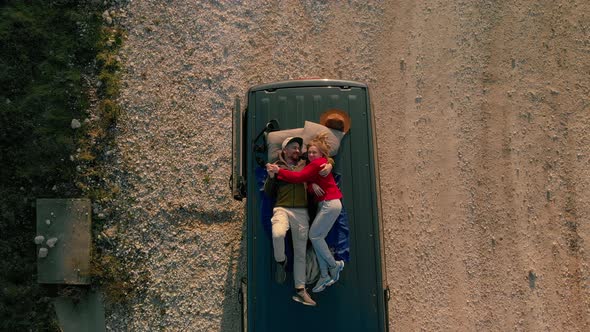 Couple on Top of Camping Van Camper Drone Shot
