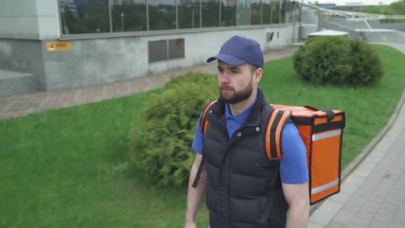 Courier with a Thermo Bag Delivers Food To the Office, the Process of Food Delivery, Food Delivery alt