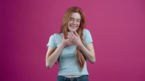 The Young Charismatic Redhead Feels Overwhelmed By Compliments the Astonished One Raises Her Hands alt