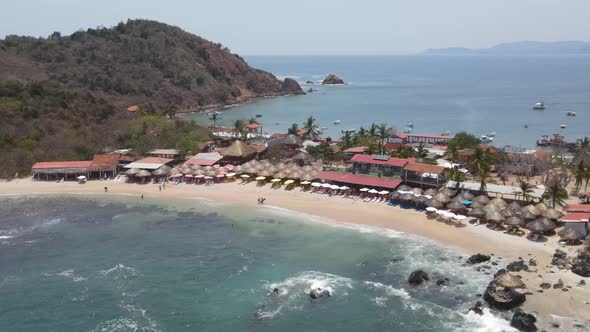 Drone flying over the skies of Ixtapa beach called Isla Grande located in the state of Guerrero, Mex alt