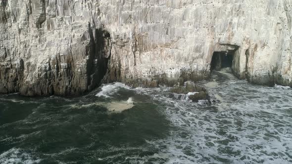 Sheer Limestone Cliffs Of Piedra de la Iglesia In Southern Chile. Aerial Slide Shot alt