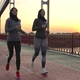 Healthy Muslim Females in Hijabs Running on Bridge - VideoHive Item for Sale