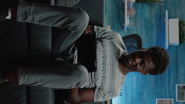 Vertical Video Modern Adult Looking at Digital Tablet for Remote Work alt