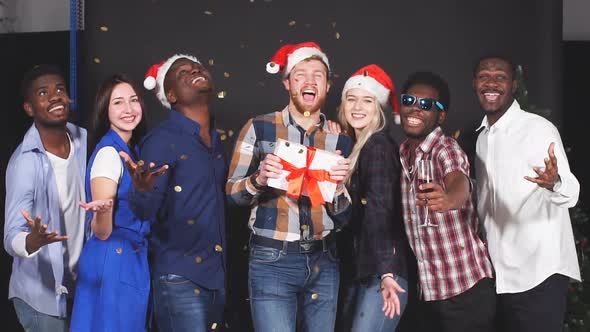 Mixed Race Group of Friends at Christmas Party, Smiling and Looking in Camera, Slow Motion.